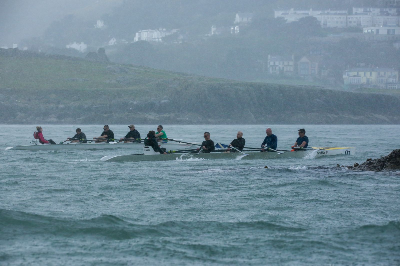 Two RSGYC crews battling through rain after rounding the Muglins Rock