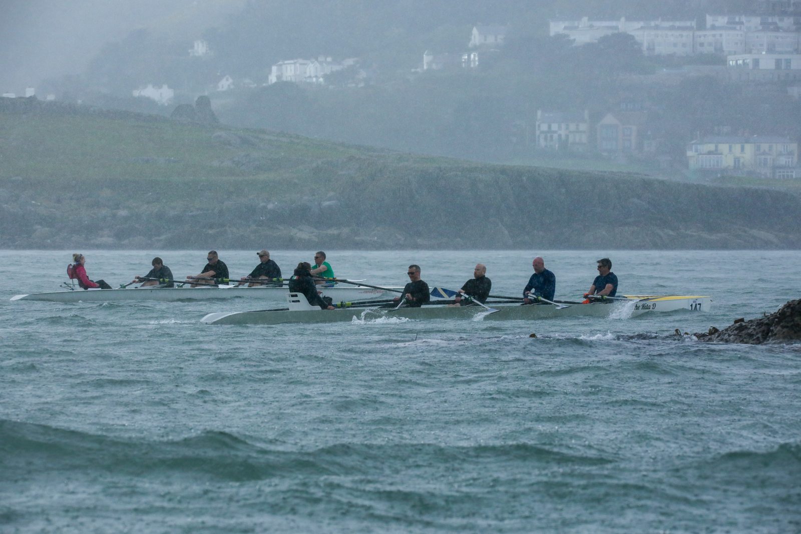 Two RSGYC crews battling through rain after rounding the Muglins Rock
